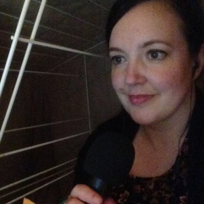 woman holding a microphone